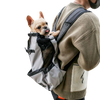 a picture of a human with a dog carrier backpack in grey with a french bulldog inside